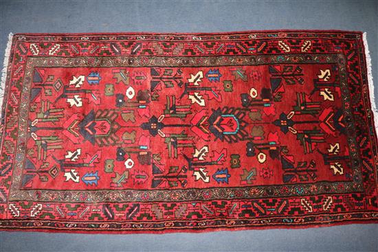 A Hamadan red ground rug, 6ft 2in by 3ft 4in.